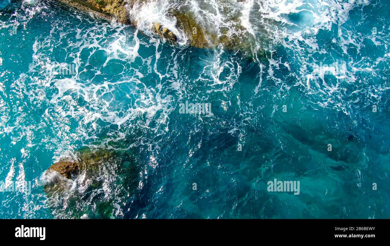 Wild Ocean water from above - Waves hitting the rocks Stock Photo - Alamy