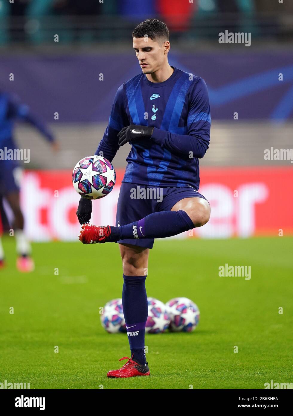 Tottenham Hotspur's Erik Lamela warms up ahead of the UEFA Champions League round of 16 second leg match at the Red Bull Arena, Leipzig. Stock Photo