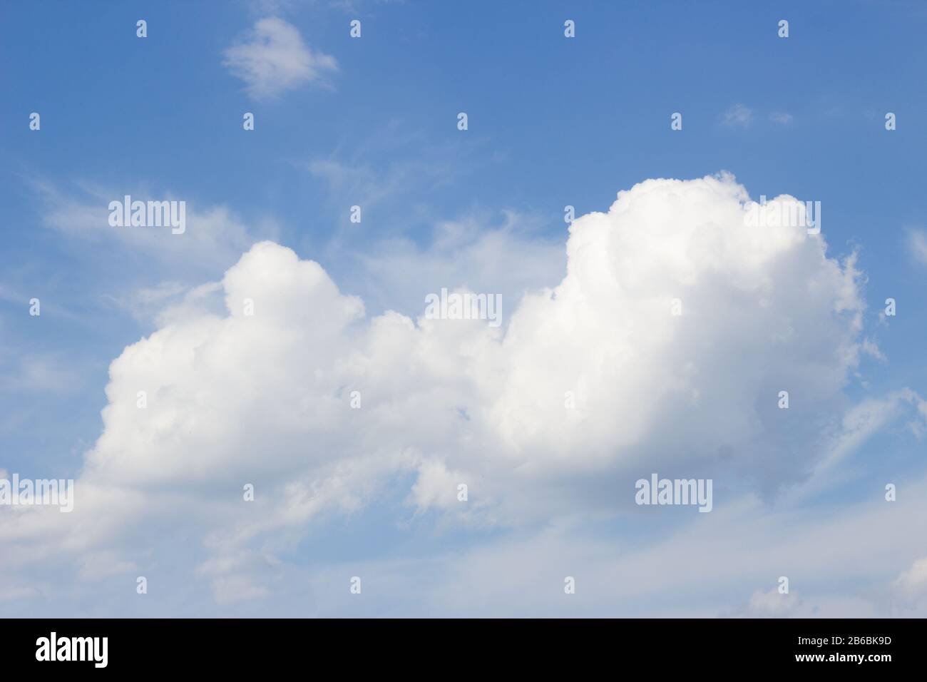 White curly clouds on a blue sky Stock Photo
