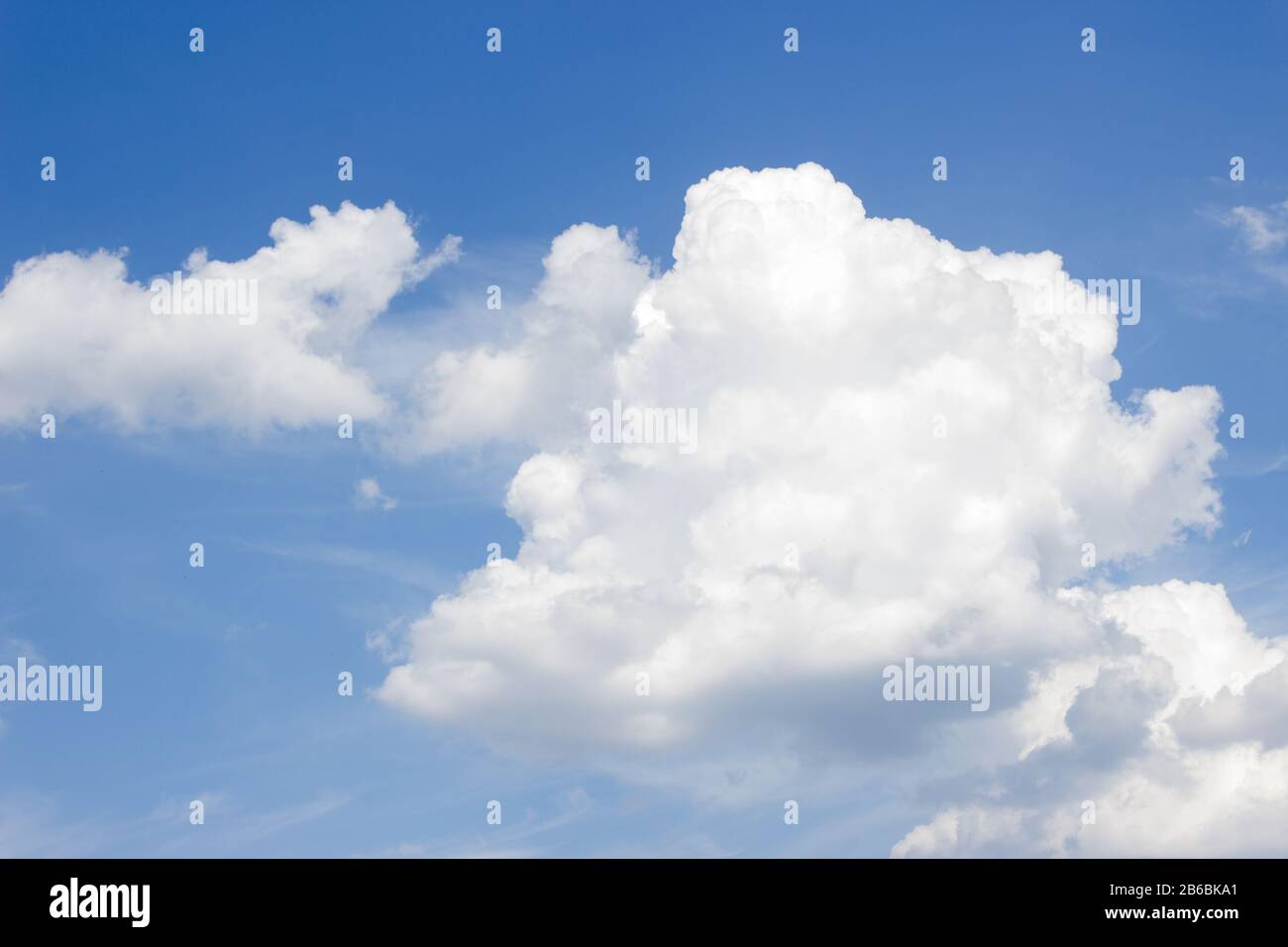 White curly clouds on a blue sky Stock Photo