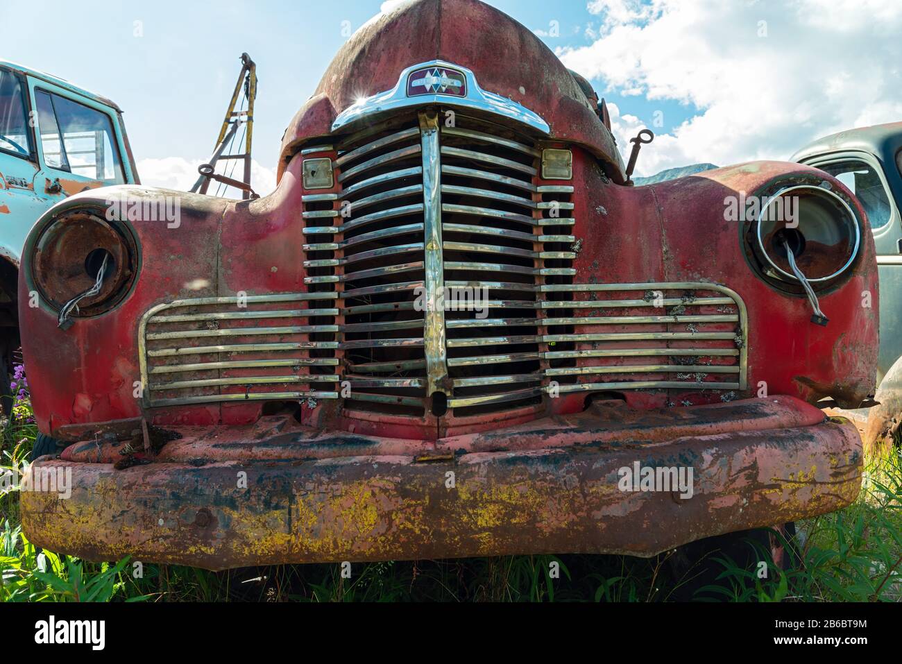 Cassiar, British Columbia, Canada - July 24, 2017: A rusty red International truck in a junkyard Stock Photo