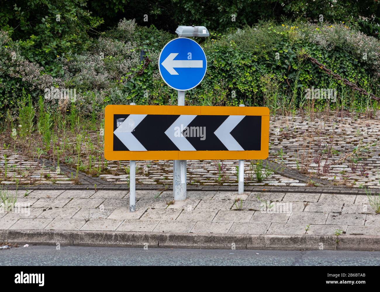 roundabout sign and chevrons Wirral August 2019 Stock Photo