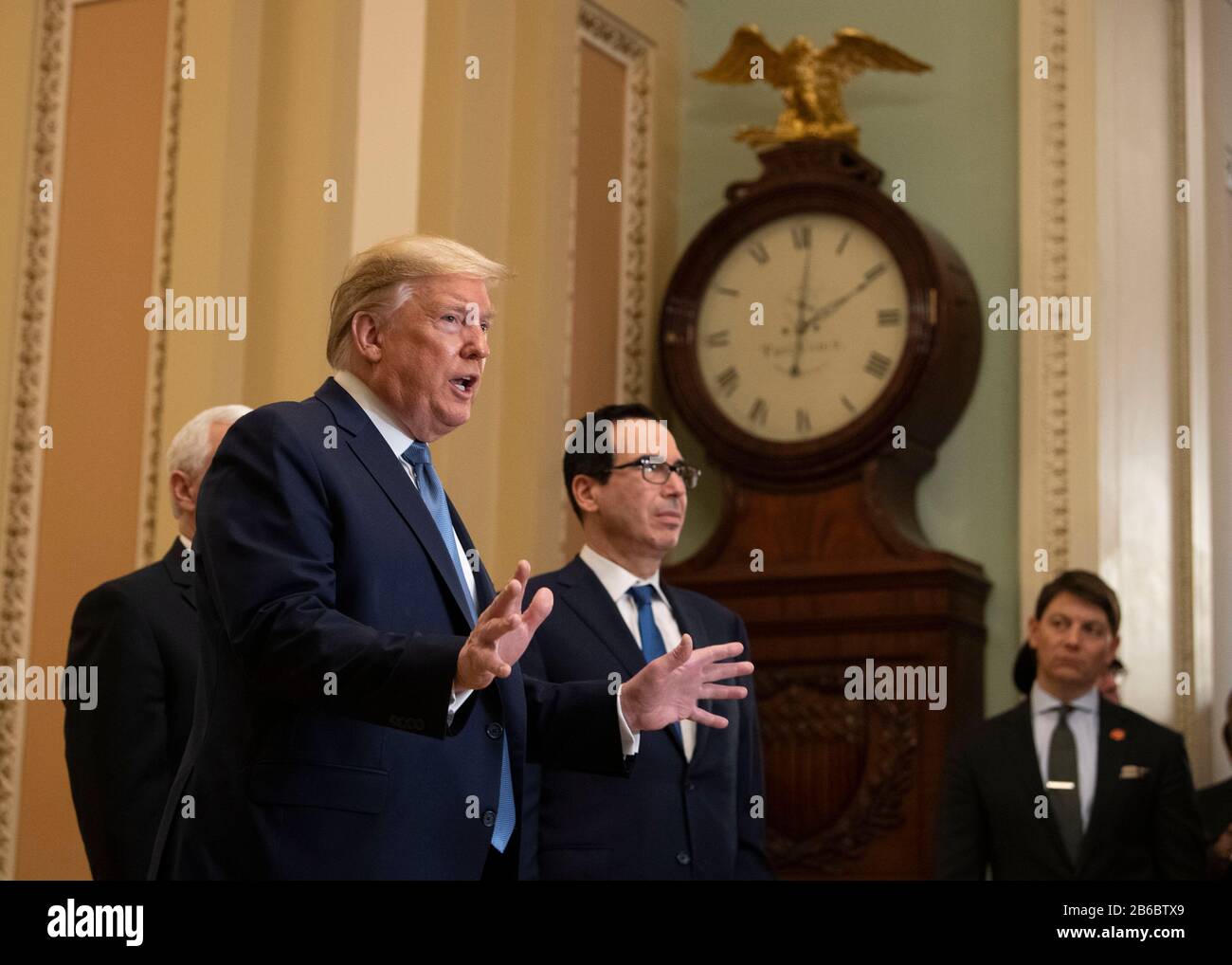 President Donald Trump (C), joined by Treasury Secretary Steven Mnuchin, speaks after meeting with Senate Republicans on a possible economic package in the wake of market turbulence caused by the Coronavirus, on in Washington, DC on March 10, 2020. Credit: Kevin Dietsch/Pool via CNP /MediaPunch Stock Photo