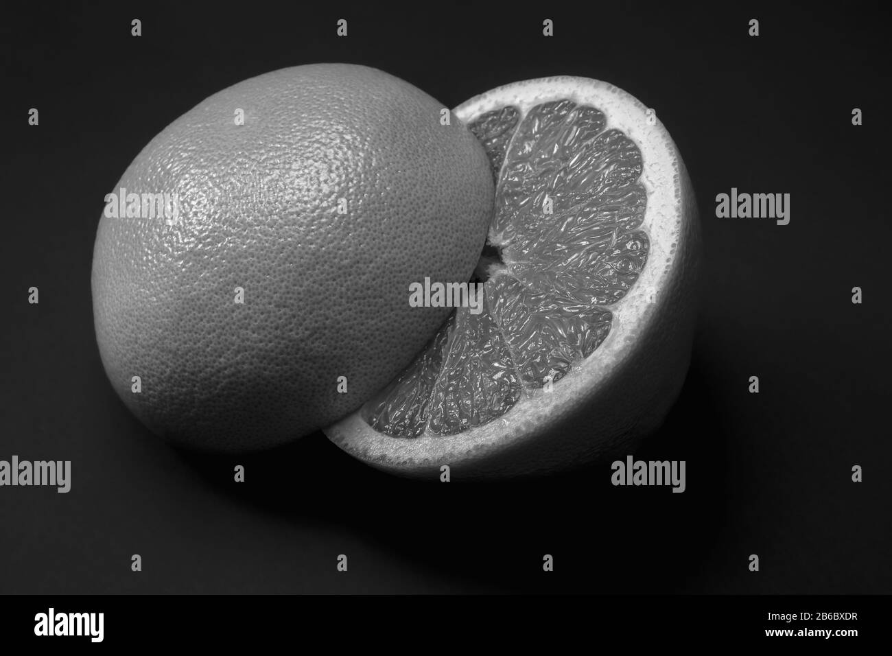 Whole half fresh ripe Black and White Stock Photos & Images - Alamy