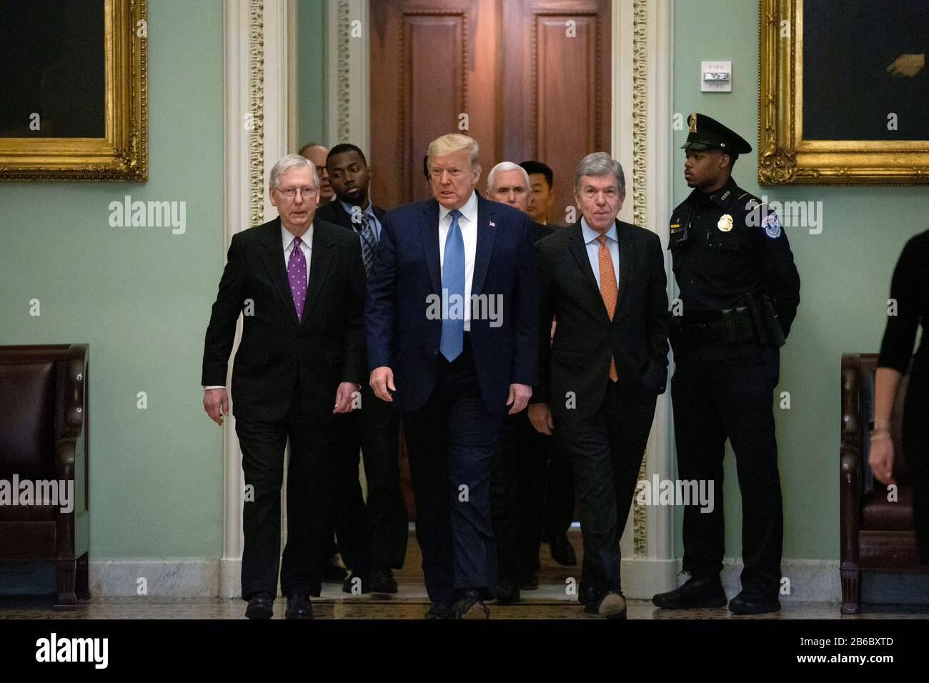 United States President Donald J. Trump, along with White House Director of Legislative Affairs Eric Ueland, United States Secretary of the Treasury Steven T. Mnuchin, and United States Vice President Mike Pence, are escorted by United States Senate Majority Leader Mitch McConnell (Republican of Kentucky) and United States Senator Roy Blunt (Republican of Missouri) to Republican Policy Luncheons at the United States Capitol in Washington D.C., U.S., on Tuesday, March 10, 2020.  Credit: Stefani Reynolds / CNP/AdMedia Stock Photo
