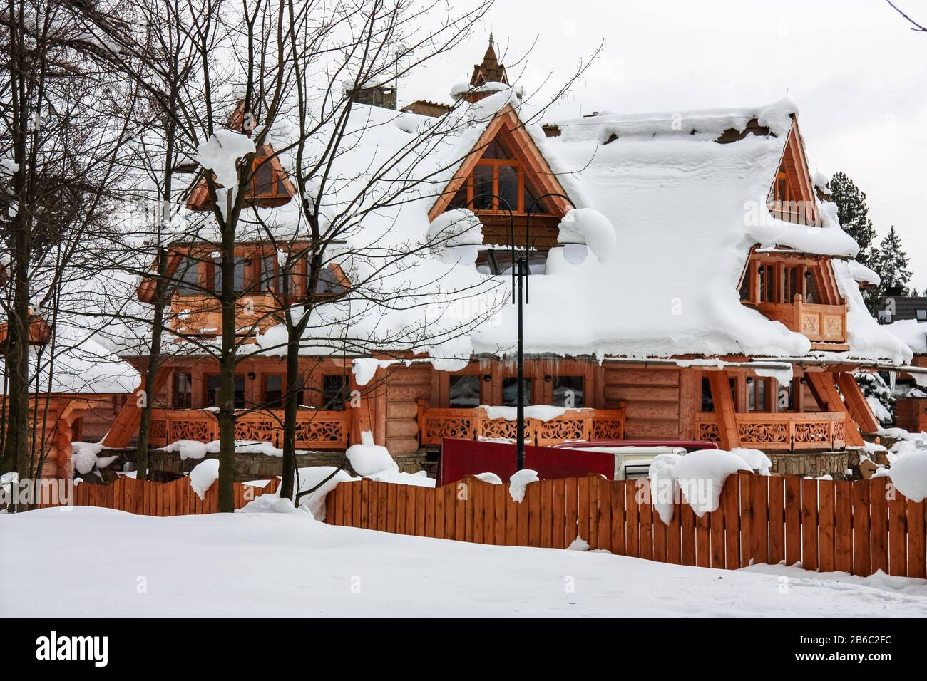 Wooden house in Zakopane, Poland. Winter with snow. Nobody Stock Photo