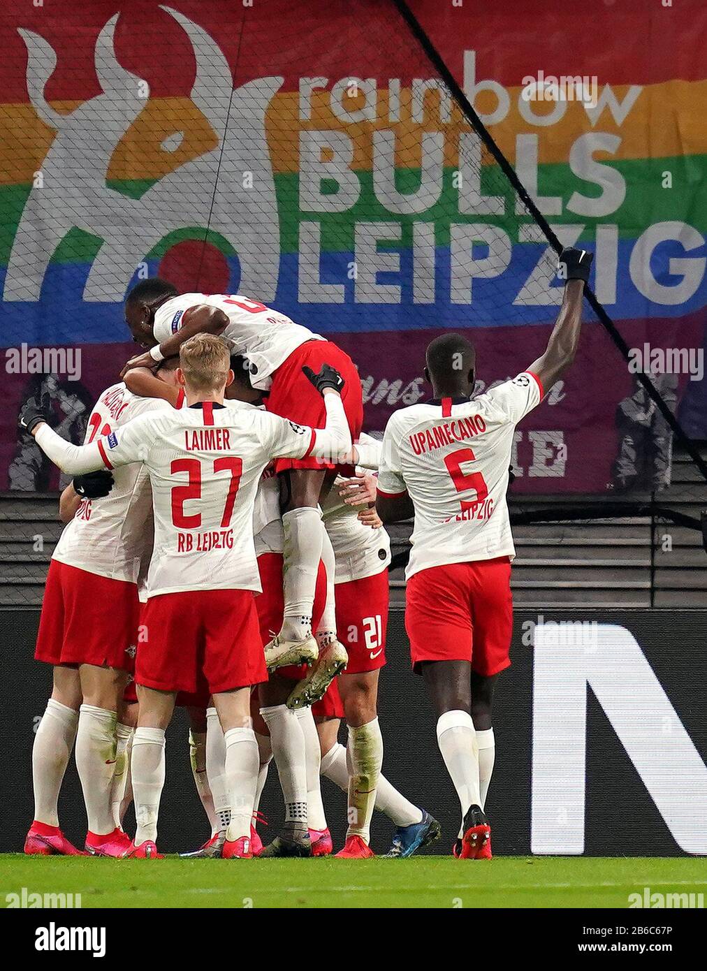 RB Leipzig's Marcel Sabitzer celebrates scoring his sides second goal of the game with teammates during the UEFA Champions League round of 16 second leg match at the Red Bull Arena, Leipzig. Stock Photo