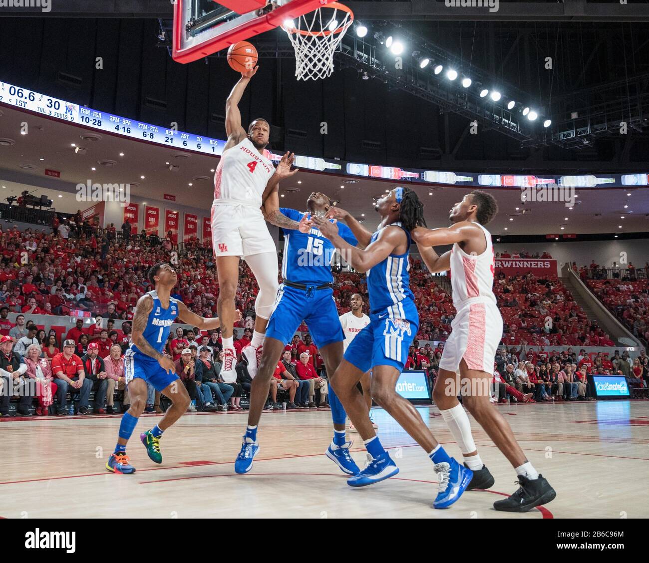 March 8, 2020: Houston Cougars forward Justin Gorham (4) grabs a rebound over Memphis Tigers forward Lance Thomas (15) in the NCAA basketball game between the Memphis Tigers and the Houston Cougars at the Fertitta Center in Houston, Texas. Houston defeated Memphis 64-57. Prentice C. James/CSM Stock Photo
