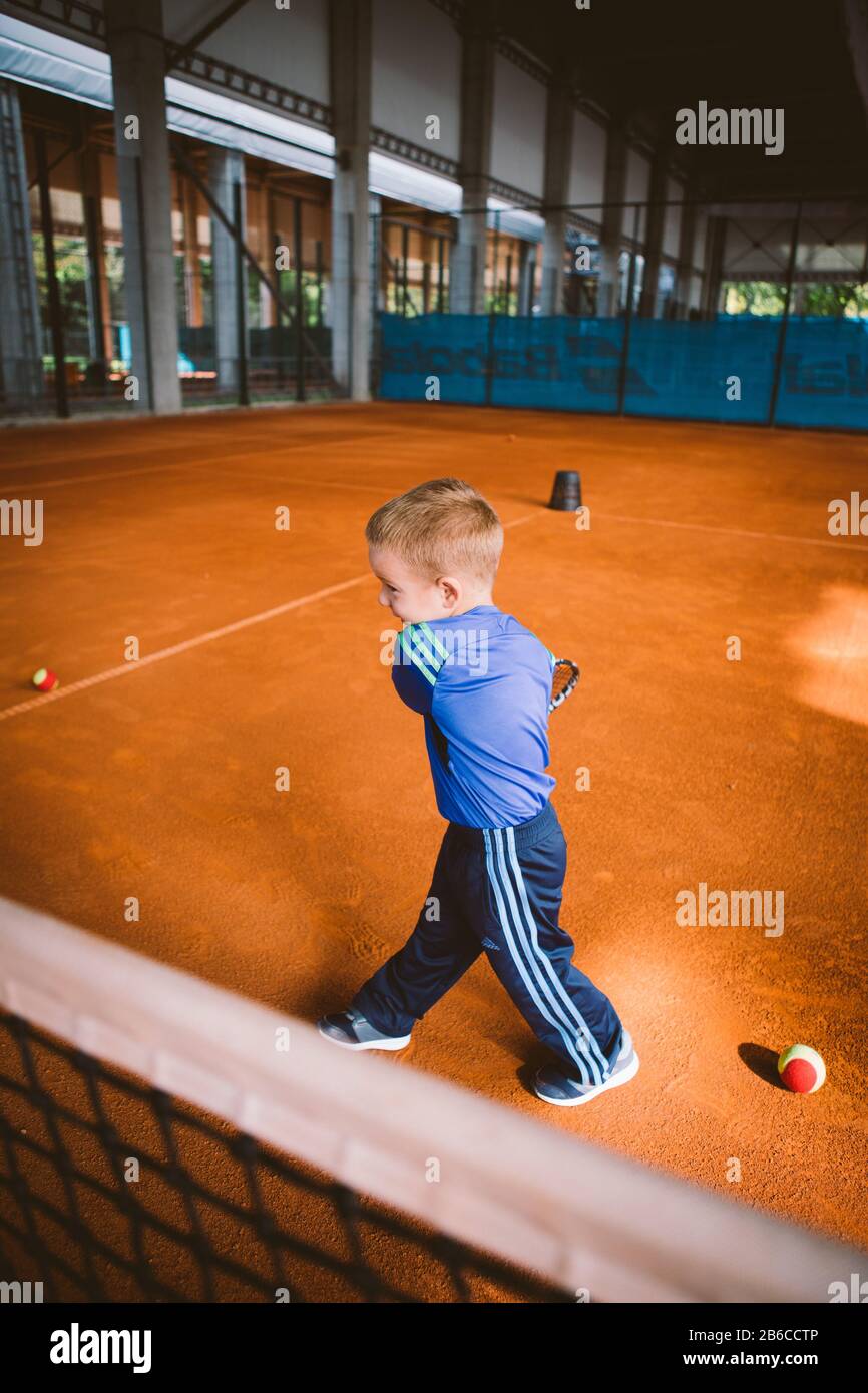 Child playing tennis on outdoor court. September 20, 2016. Ukraine, Kiev.  Little tennis great player. Children sportswear adidas. Child athlete Stock  Photo - Alamy