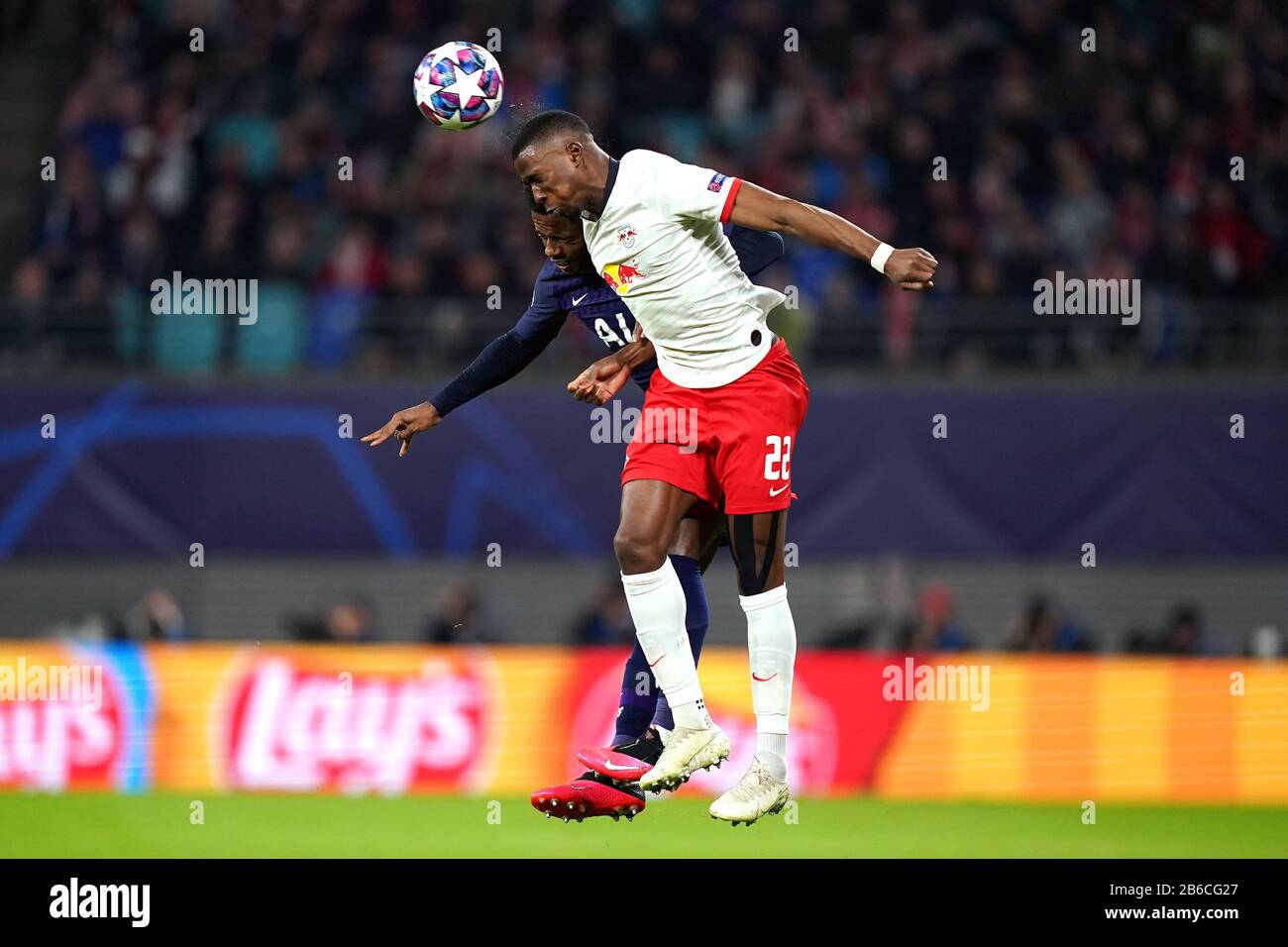 Tottenham Hotspur's Ryan Sessegnon (left) and RB Leipzig's Nordi Mukiele battle for the ball during the UEFA Champions League round of 16 second leg match at the Red Bull Arena, Leipzig. Stock Photo