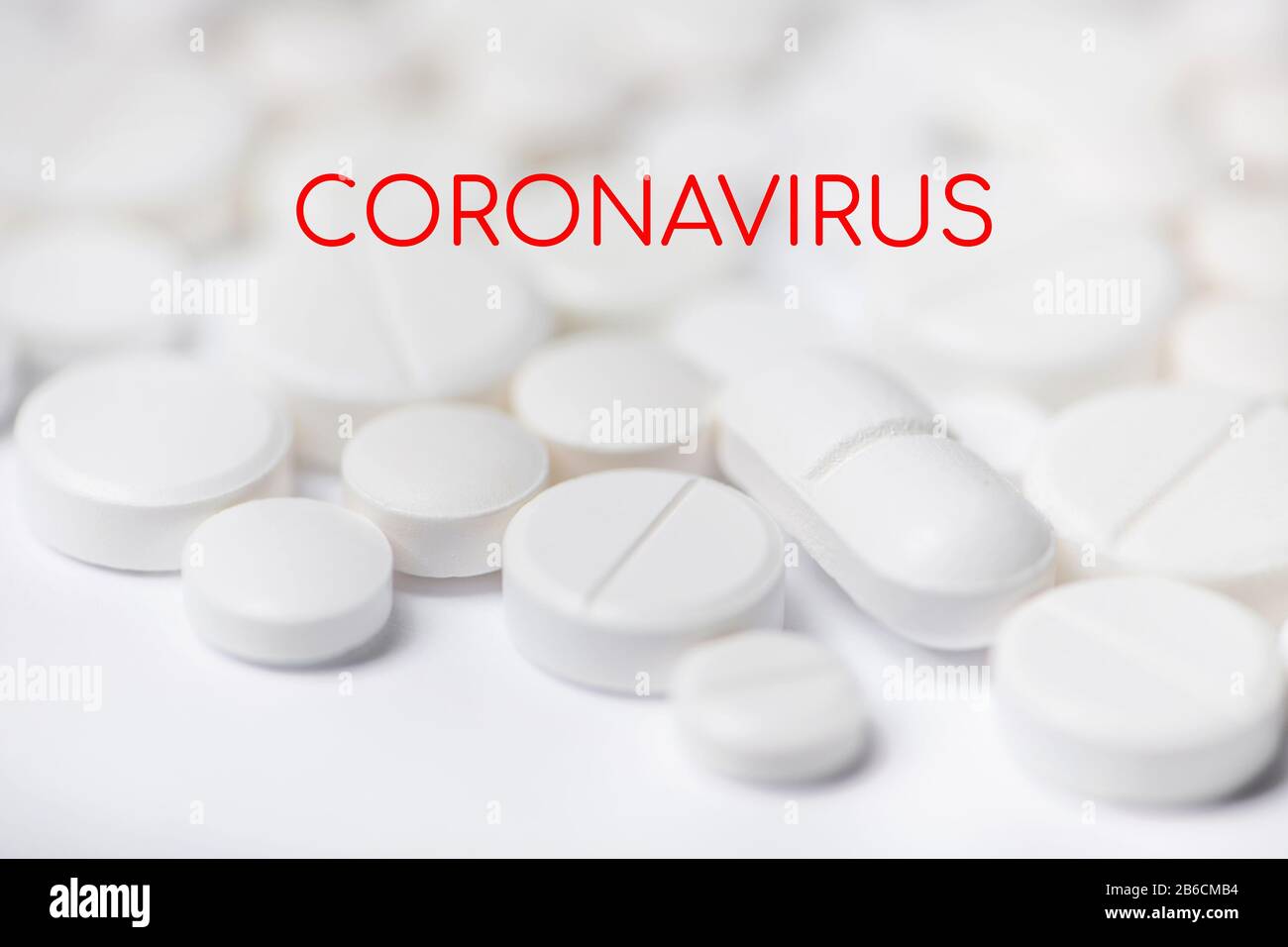 Pills with coronavirus inscription on white background. Concept novel coronavirus 2019-nCoV. Chinese coronavirus outbreak. Stock Photo