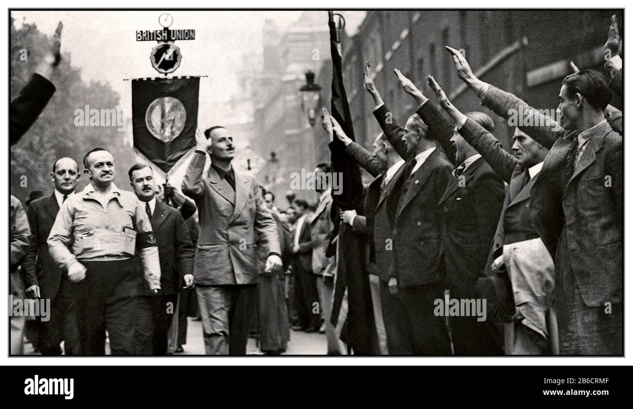 OSWALD MOSLEY BUF PARTY 1930s Great Britain Oswald Mosley, leader of  'British Union of Fascists' taking a far right Nazi type salute from supporters during a facist rally in London 1937 Head of British Union of Fascists Stock Photo