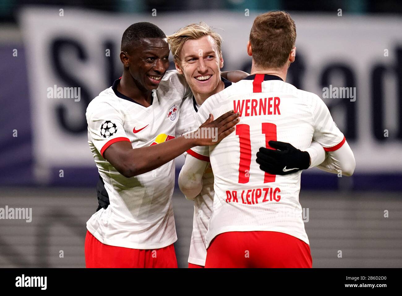 RB Leipzig's Emil Forsberg (centre) celebrates scoring his sides third goal of the game with teammates during the UEFA Champions League round of 16 second leg match at the Red Bull Arena, Leipzig. Stock Photo