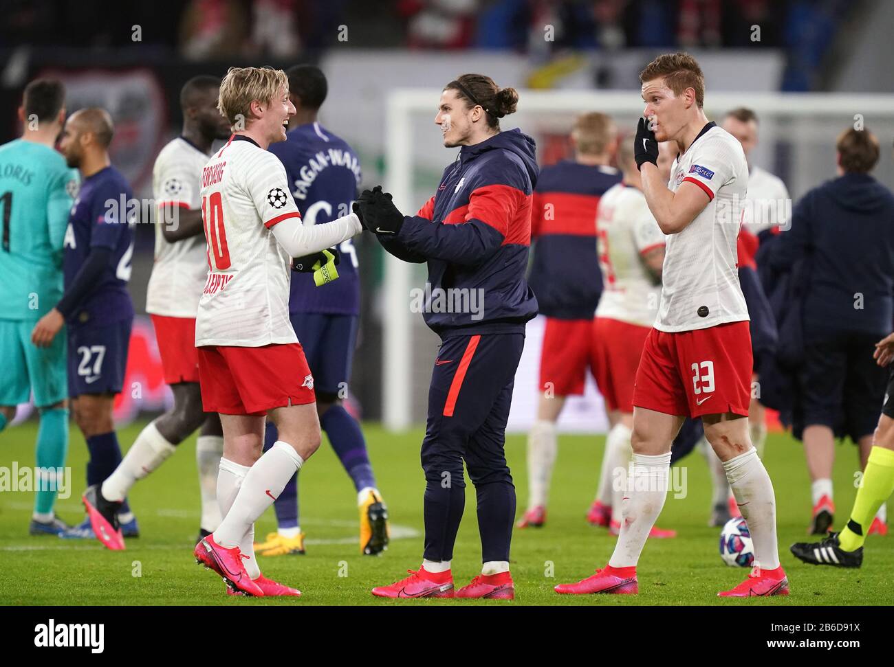 RB Leipzig celebrate their victory after the final whistle at the UEFA Champions League round of 16 second leg match at the Red Bull Arena, Leipzig. Stock Photo