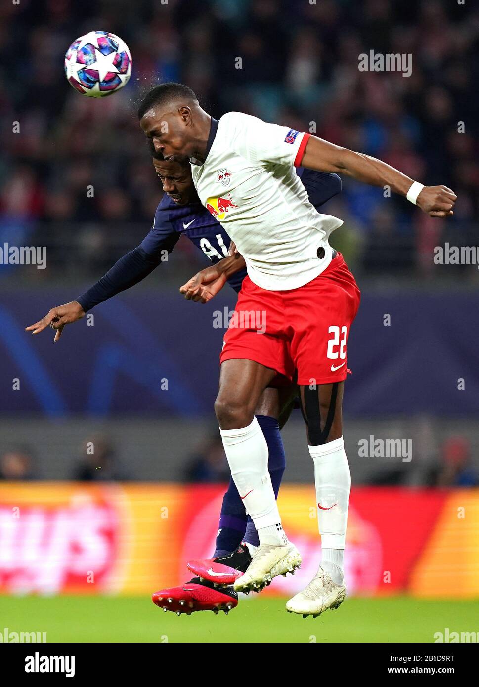 Tottenham Hotspur's Ryan Sessegnon (left) and RB Leipzig's Nordi Mukiele battle for the ball during the UEFA Champions League round of 16 second leg match at the Red Bull Arena, Leipzig. Stock Photo