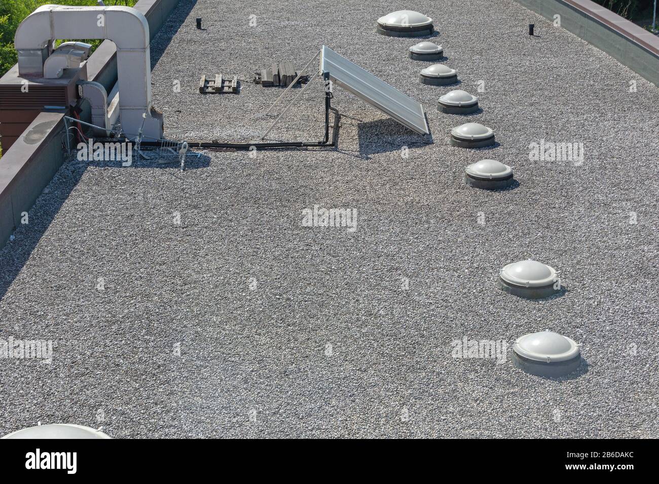 Solar Cells and Skylight Windows at Gravel Flat Roof Stock Photo Alamy