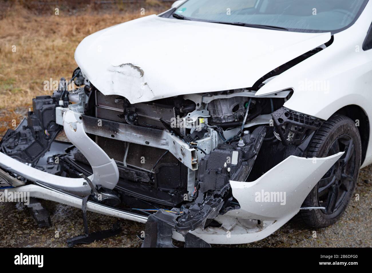 Damaged front of a car caused by an accident Stock Photo