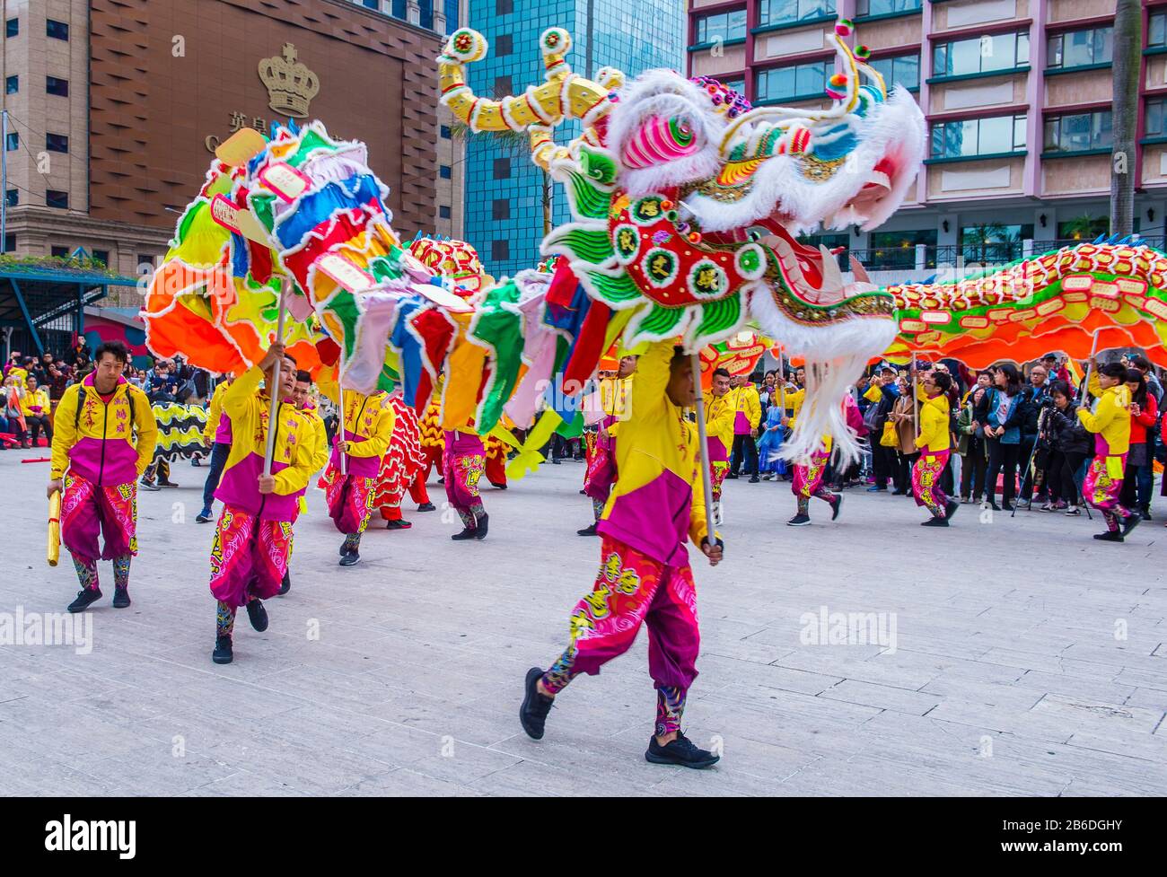 Dancers perform a Dragon dance during the Macau International Dragon and Lion Dance Day event at Praca da Amizade in Macau Stock Photo