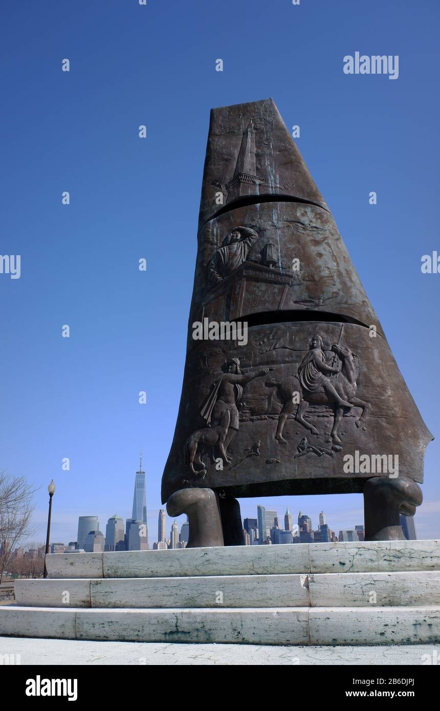 Bronze monument of Sail of Columbus commemorates the 500th anniversary of Christopher Columbus sail to America with the skyline of Lower Manhattan of New York City in background.Liberty State Park.New Jersey.USA Stock Photo