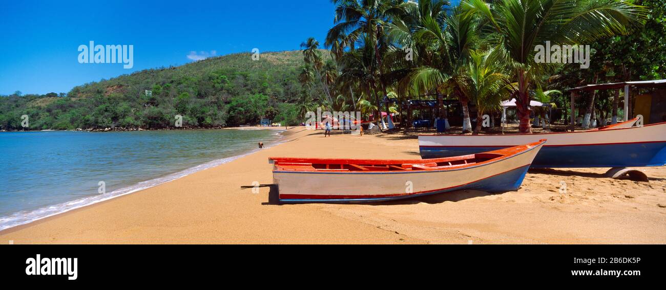 Boats on the beach, Colorada Beach, Mochima National Park, Anzoategui State-Sucre State, Venezuela Stock Photo