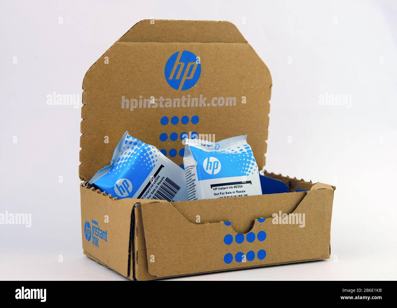 HP Instant Ink box with printer cartridges that you receive by post on subscription bases. Stock Photo