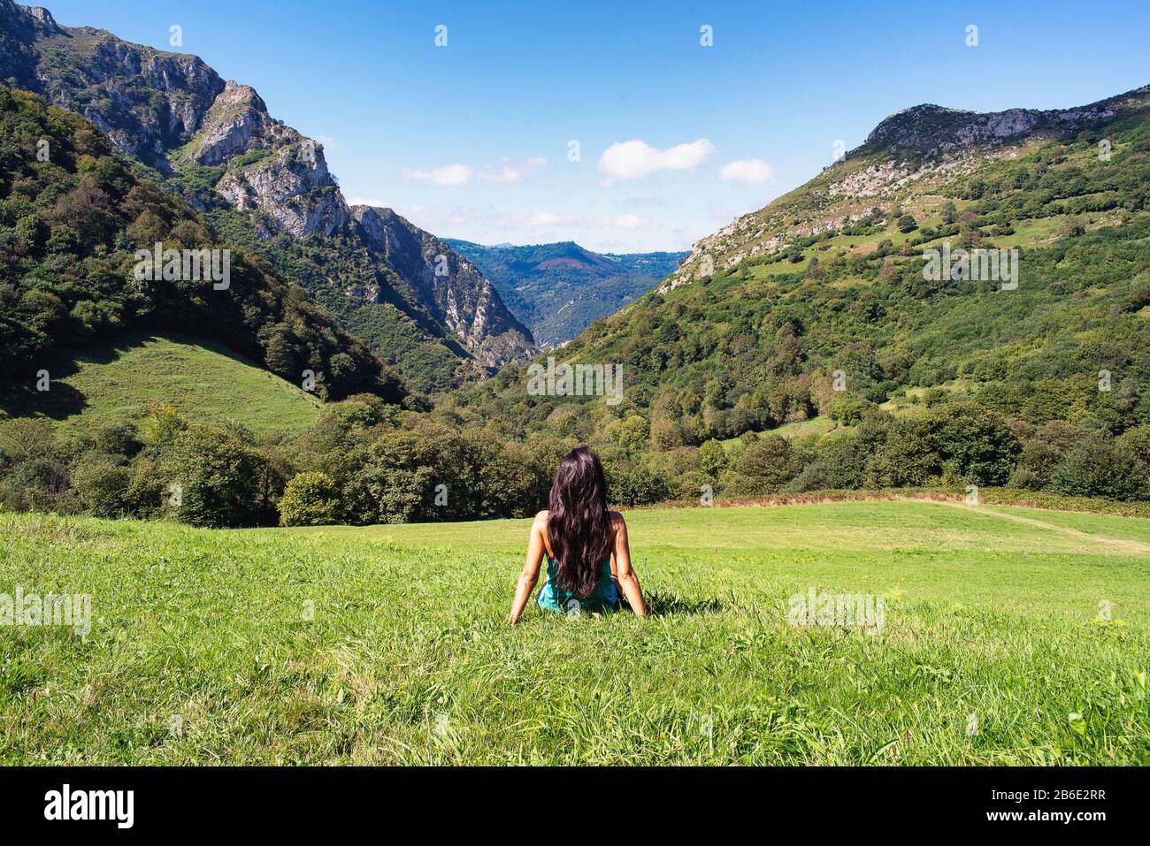Landscape of woman in mountains of Asturias, Spain Stock Photo