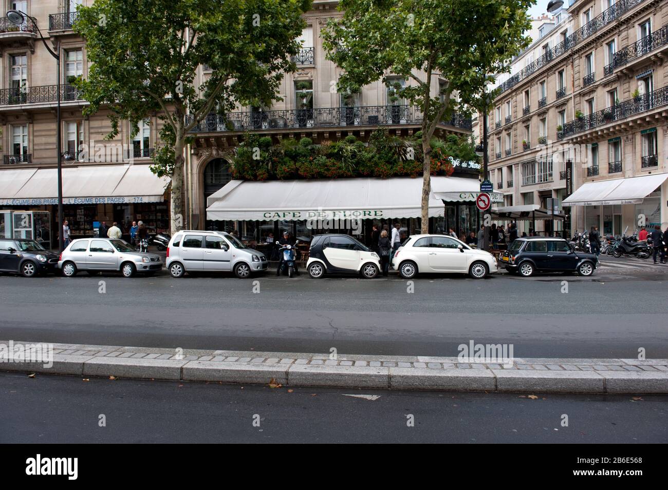Cars parked in front of a cafe, Cafe de Flore, Boulevard St. Germain, Paris, Ile-de-France, France Stock Photo