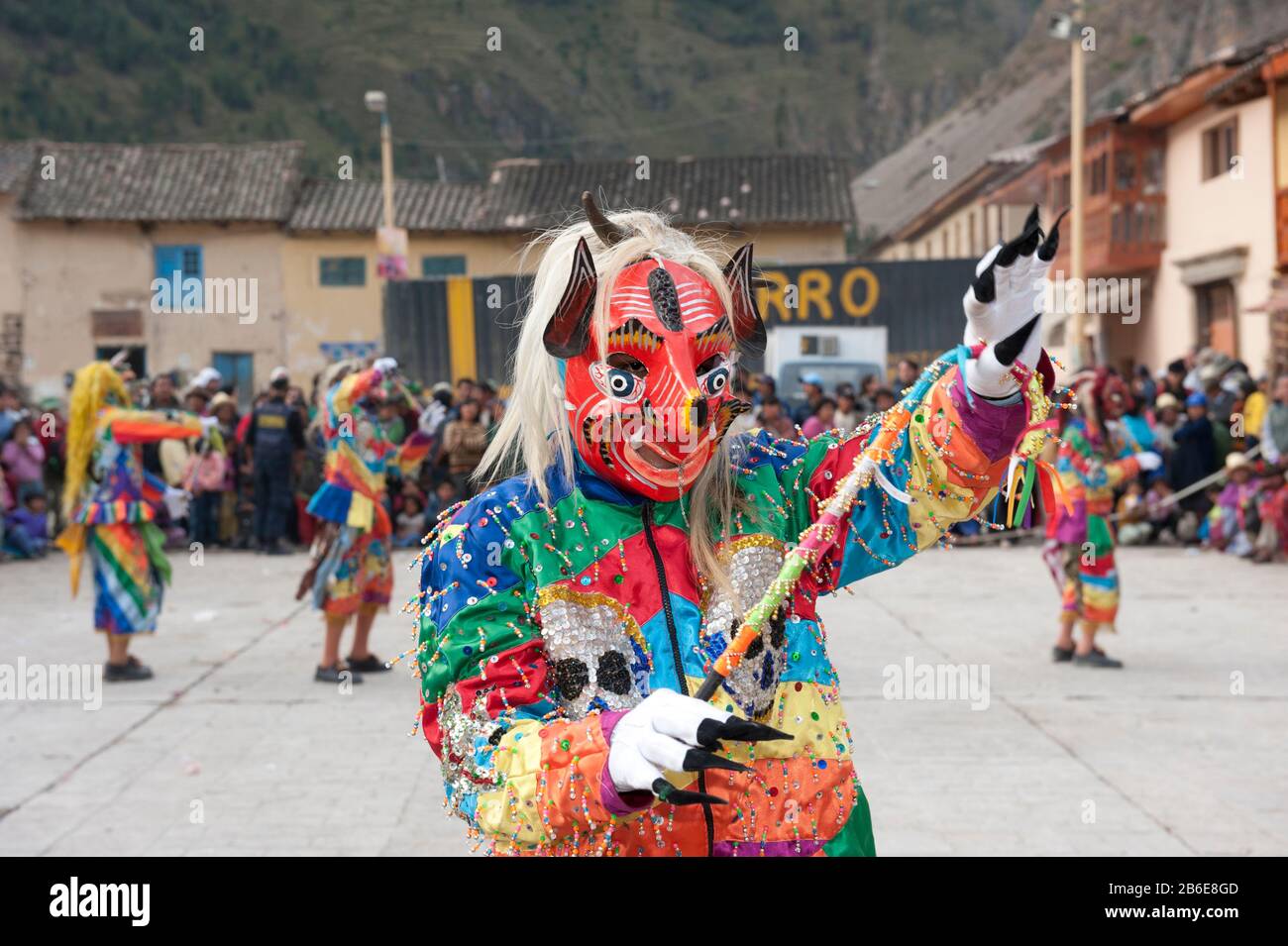 Masked performers celebrating Pentecost at town square, Ollantaytambo, Urubamba Province, Cusco Region, Peru Stock Photo