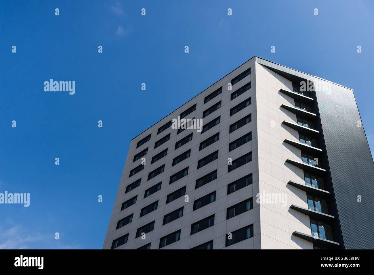 A modern architecture skyscraper against blue sky Stock Photo - Alamy