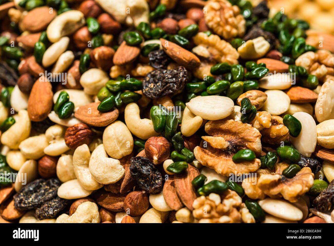 Dried fruit and nuts mix with raisins, almonds, walnuts, cashew nuts, hazelnuts. Stock Photo