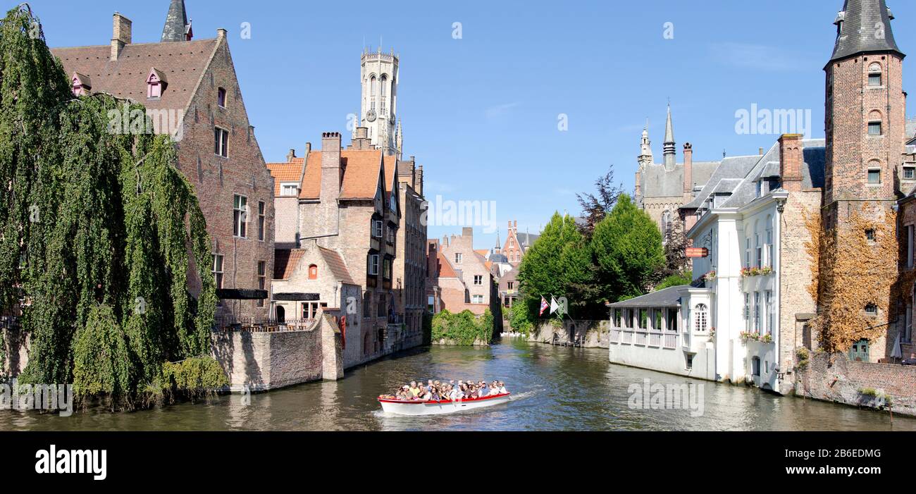 Tourboat in a canal, Bruges, West Flanders, Belgium Stock Photo