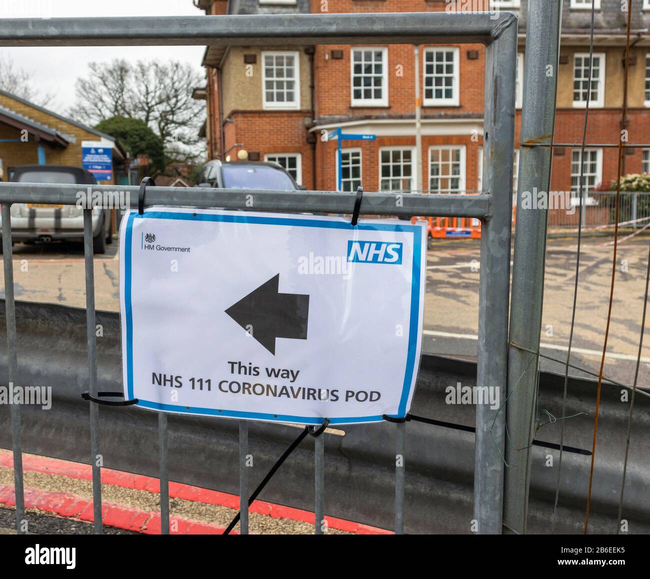 Sign pointing to a Coronavirus Pod at Southampton General Hospital, a teaching hospital run by University Hospital Southampton NHS Foundation Trust Stock Photo