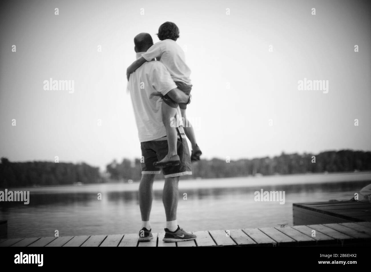 View of a man and his son enjoying beautiful scene. Stock Photo