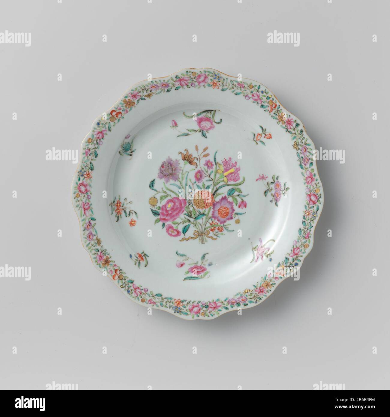 Plate with a bouquet, loose flowers and tendrils Bord van porselein met een golvende rand, beschilderd op het glazuur in blauw, rood, roze, groen, geel, paars, zwart en goud. Op het plat een boeket omgeven door losse bloemen; op de rand een band met bloem- en fruitranken. Een barst in de rand. Famille rose. Manufacturer : pottenbakker: anoniemPlaats manufacture: China Dating: ca. 1750 - ca. 1774School / stijl: Qing-dynastie (1644-1912) / Qianlong-periode (1736-1795) Physical kenmerken: porselein met emailkleuren en verguldsel Material: porselein glazuur email goud Techniek: draaiend bewerken / Stock Photo