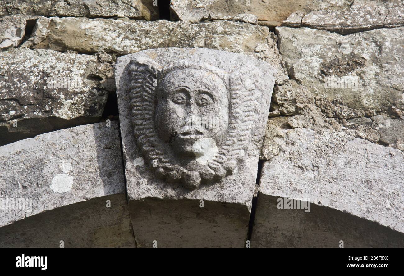 Stone face, stone portal of the curch of Saint Socerb in Artvize, Slovenia, Mediterranean Europe Stock Photo