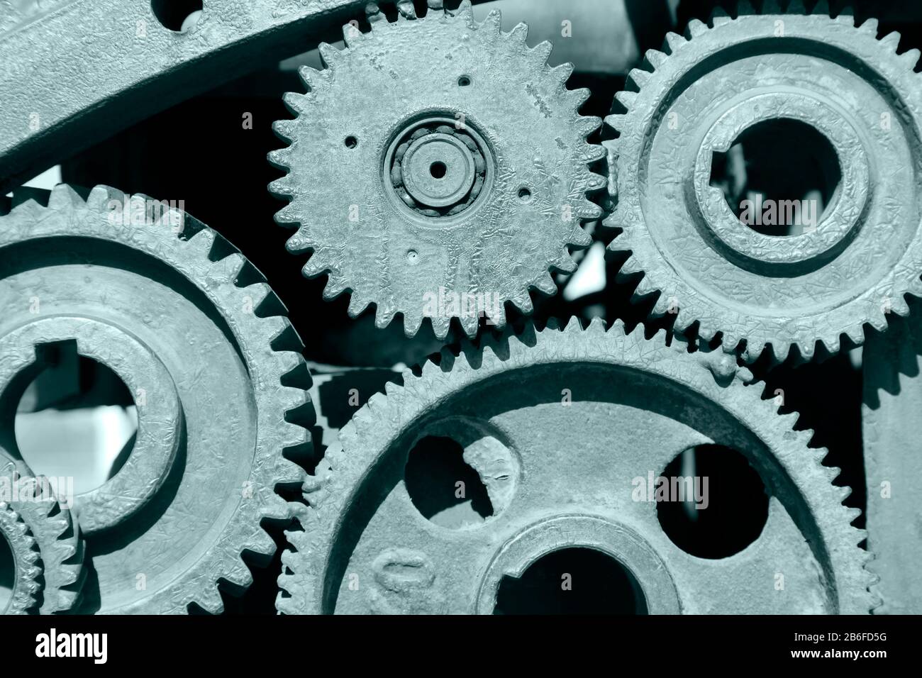 Gears interlocked cogs turning machinery hi-res stock photography and ...