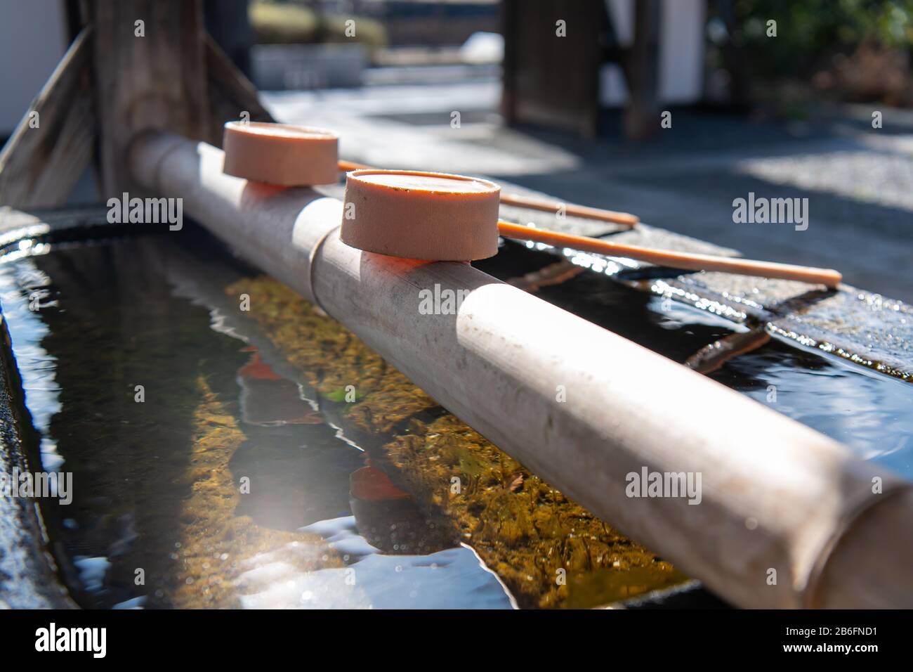 Water scoop at the approach to the shrine , Japanese water ablution pavilion, Matsumoto Shrine , Matsumoto, Japan. Stock Photo