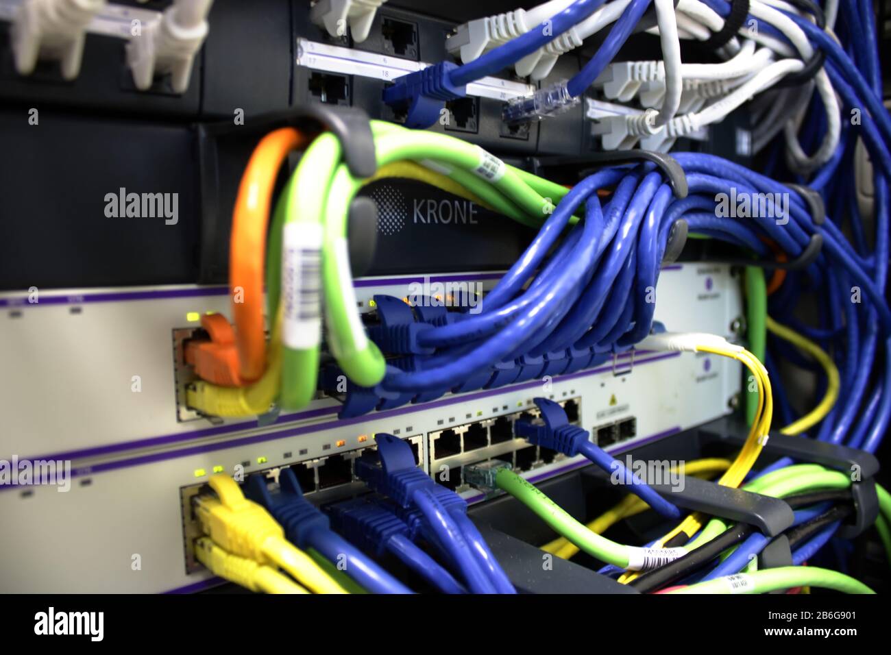 cables and fibre optic cable plugged into servers Stock Photo