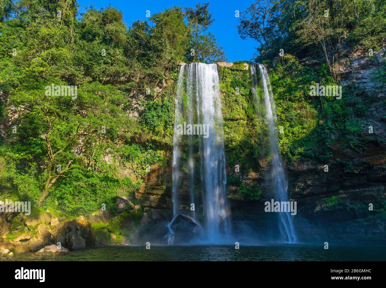 The waterfall of Misol Ha at sunset with spray in the air near Palenque, Chiapas state, Mexico. Stock Photo