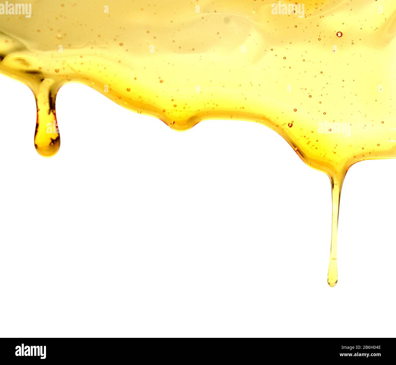 Flow and drop of honey Stock Photo - Alamy