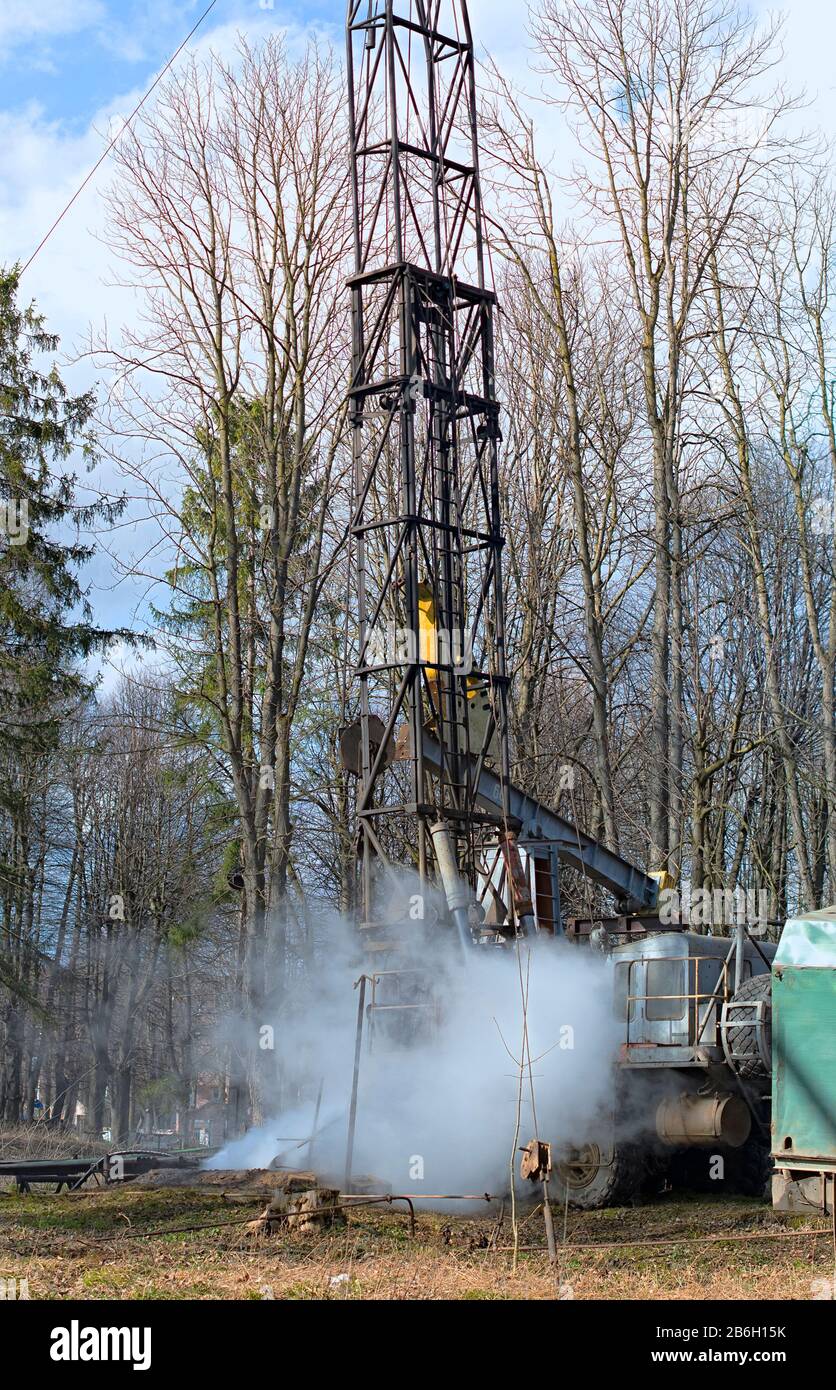 Old Workover Rig Workover rig working on a previously drilled well trying to restore ...