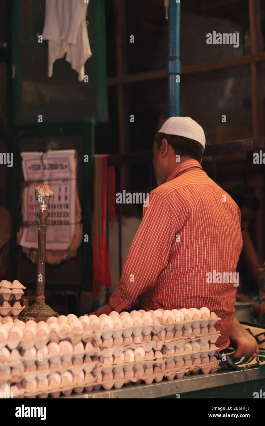 Muslim man pray in his stall at New Market, Kolkata Stock Photo