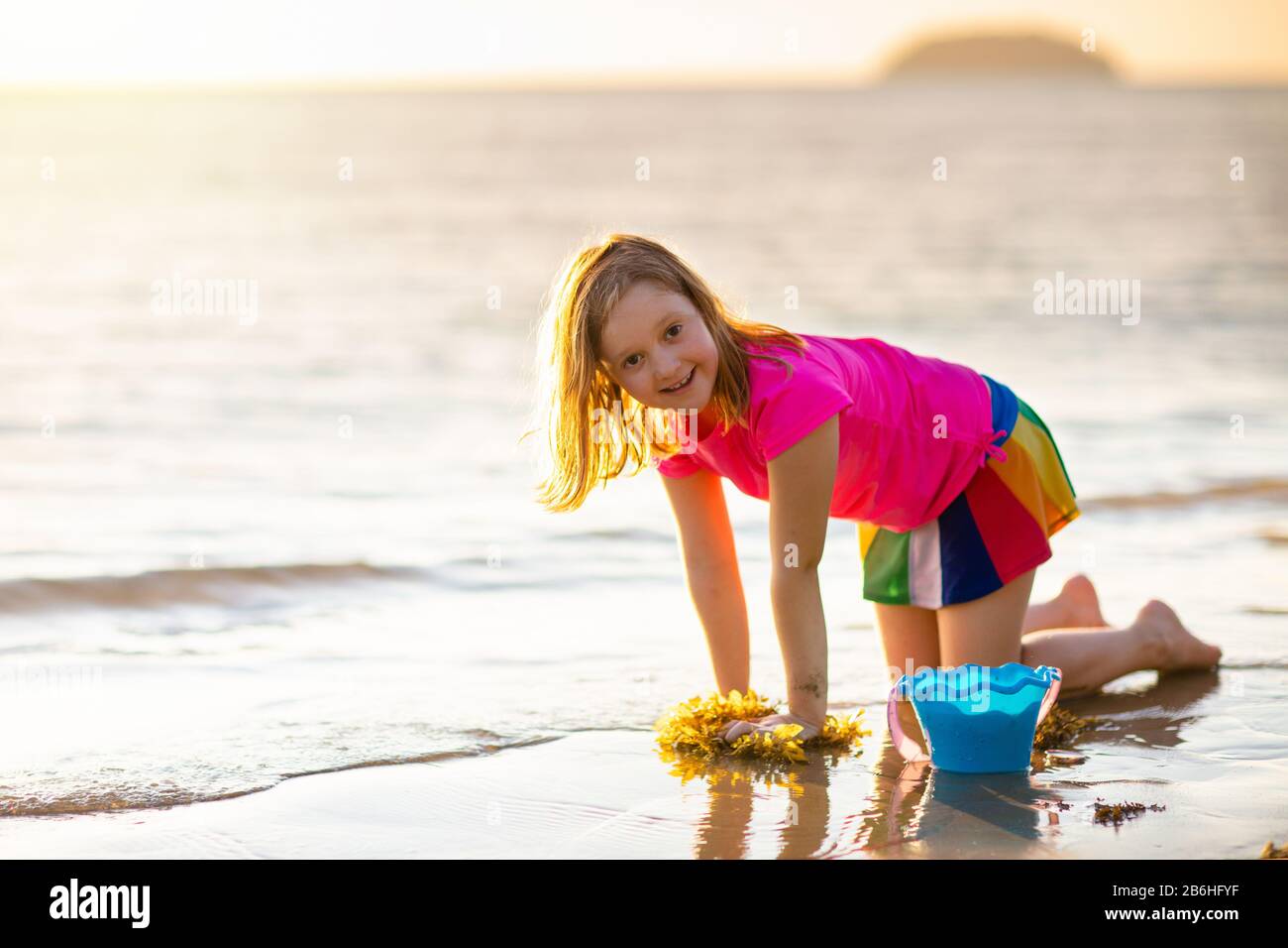 Kids Playing On Tropical Beach Children Swim And Play At Sea On Summer Family Vacation Sand And Water Fun Sun Protection For Young Child Little Gi Stock Photo Alamy