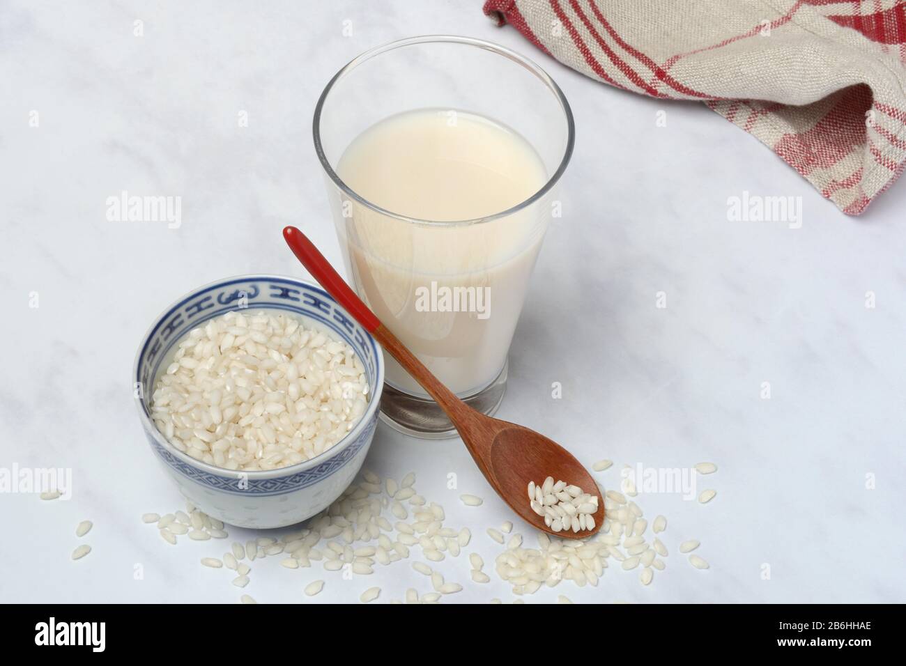 Rice milk in glass and rice grains, Germany Stock Photo Alamy
