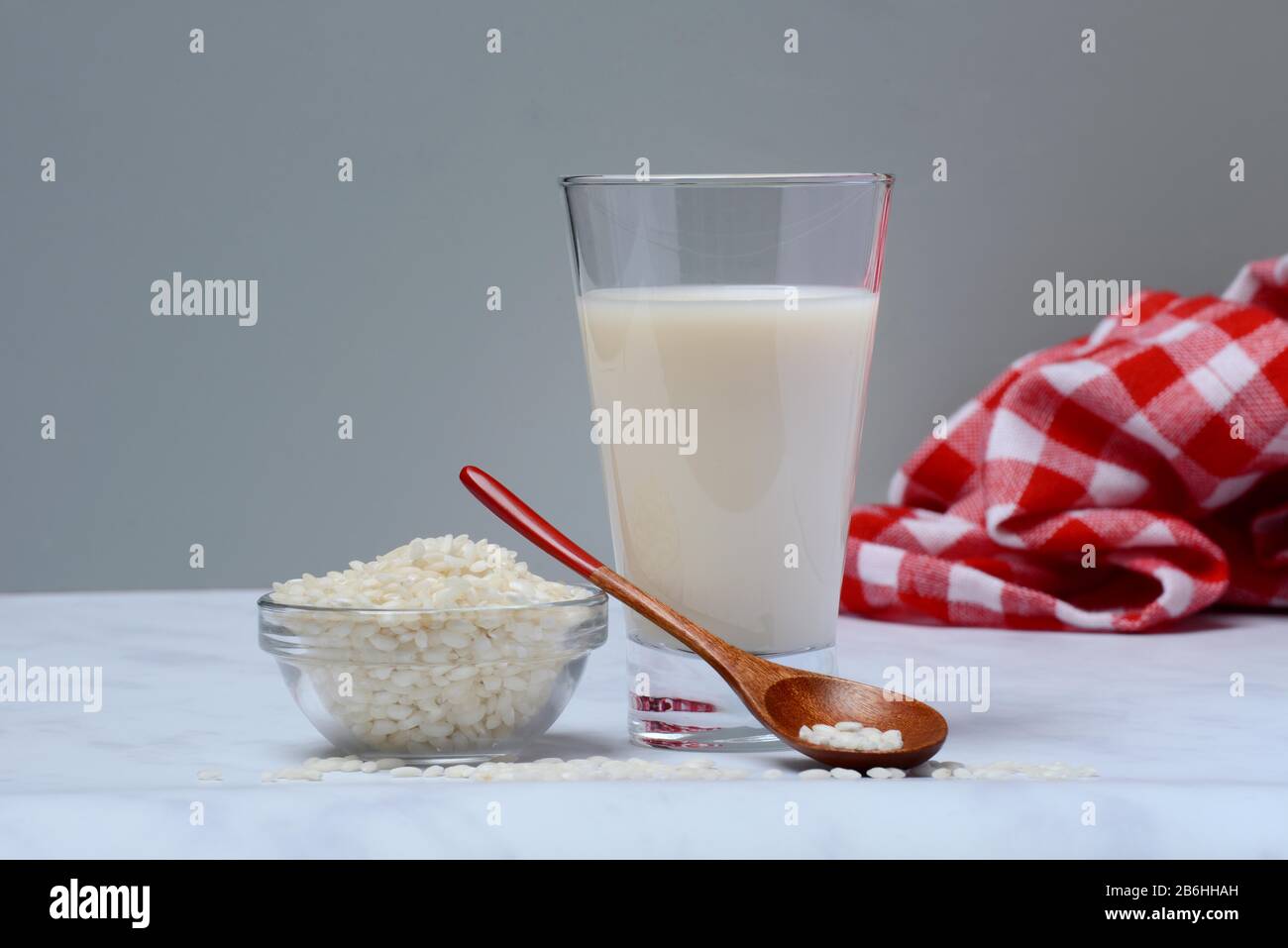 Rice milk in glass and rice grains, Germany Stock Photo Alamy