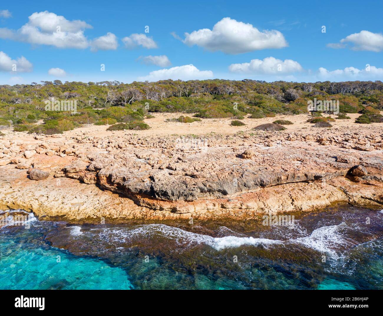 Rocky coast at Cap de ses Salines, southernmost point of Majorca, Migjorn region, Mediterranean Sea, aerial view, Majorca, Balearic Islands, Spain Stock Photo