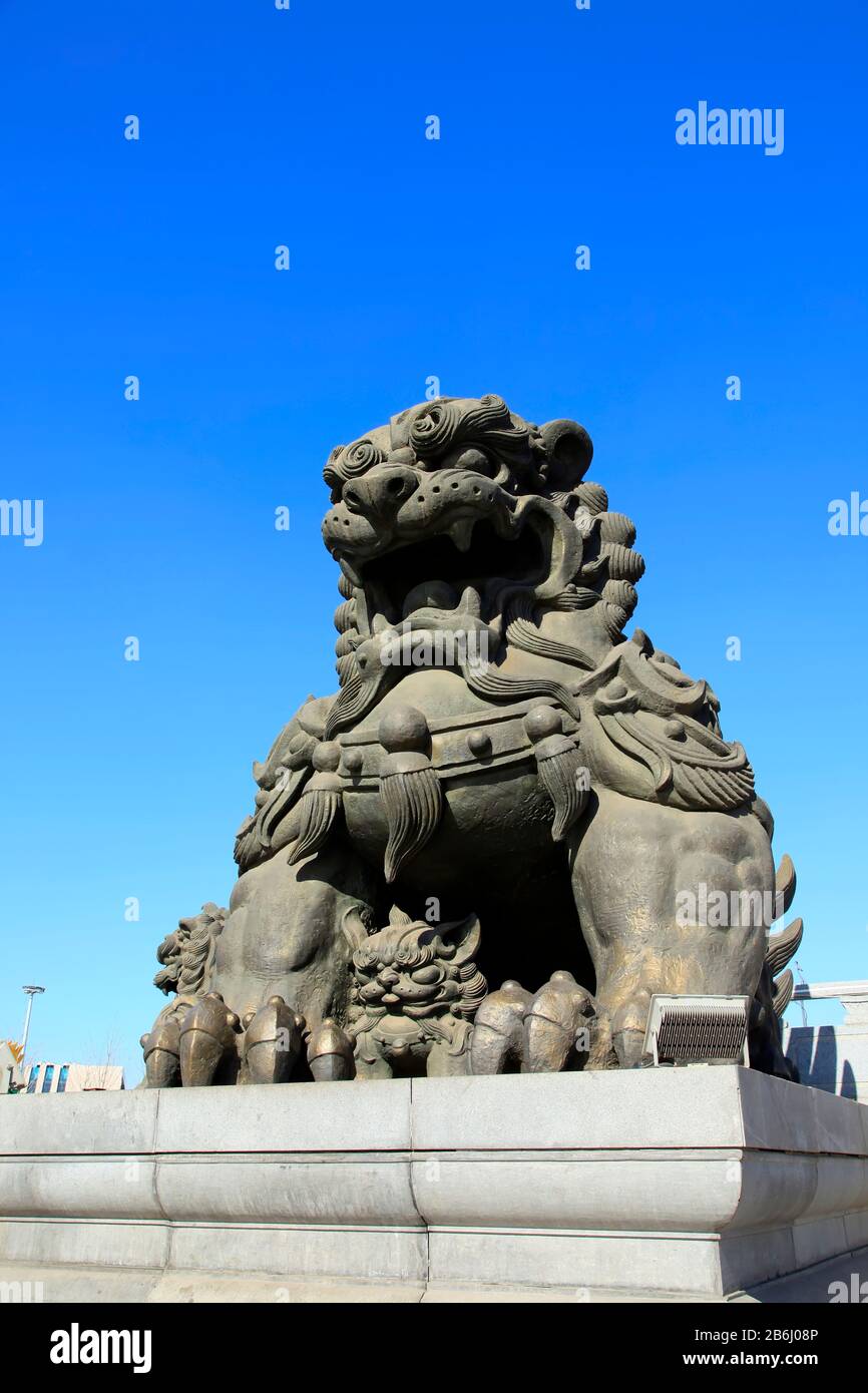 Bronze lion under the blue sky Stock Photo - Alamy