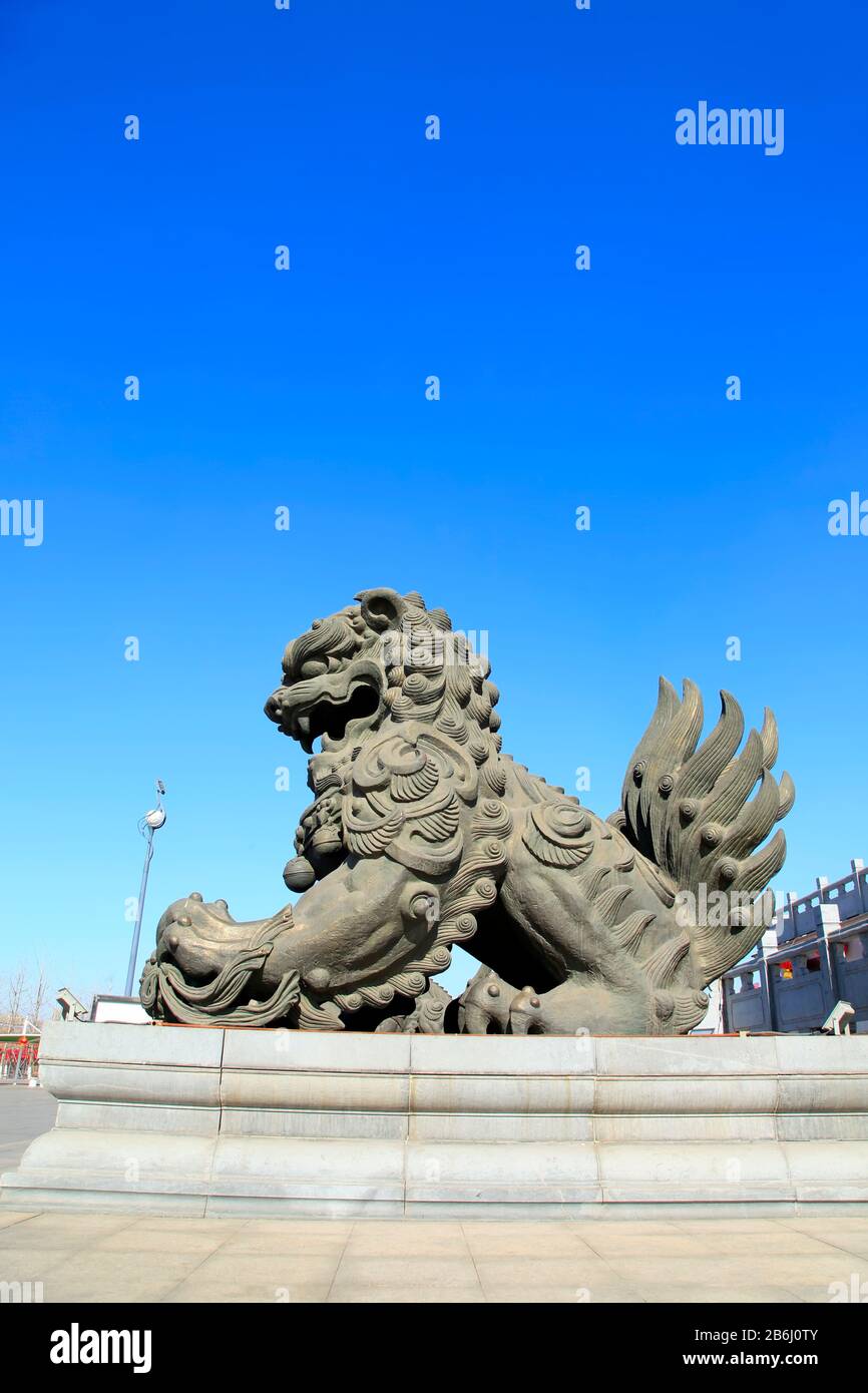Bronze lion under the blue sky Stock Photo - Alamy