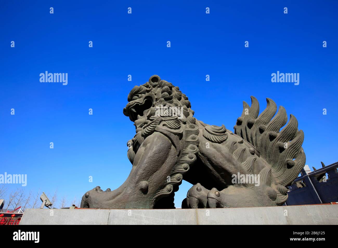 Bronze lion under the blue sky Stock Photo - Alamy