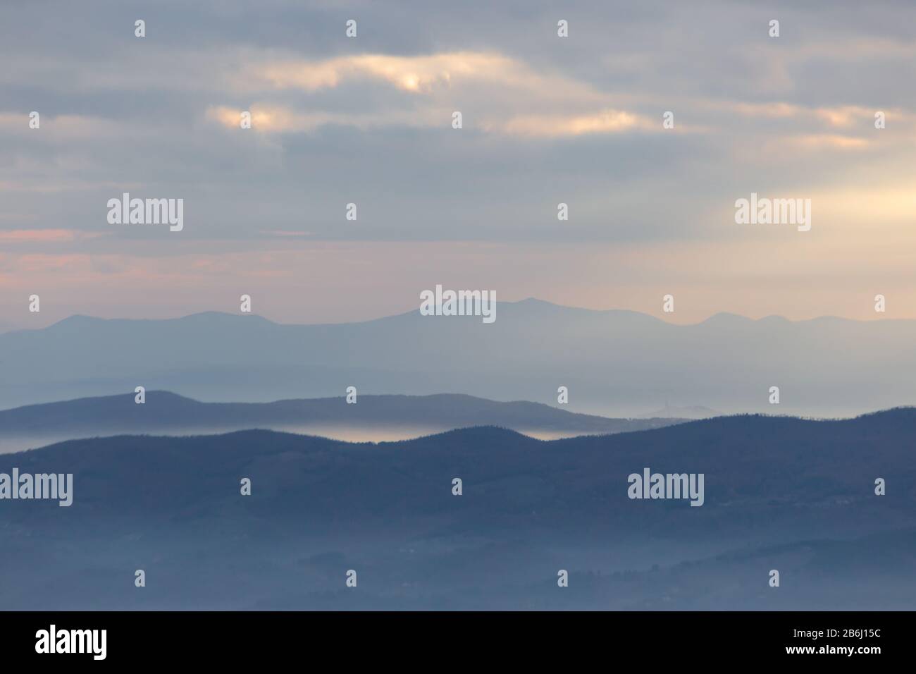 Mist Between Two Ridges Sea of fog and mist between layers of mountains and hills Stock Photo ...